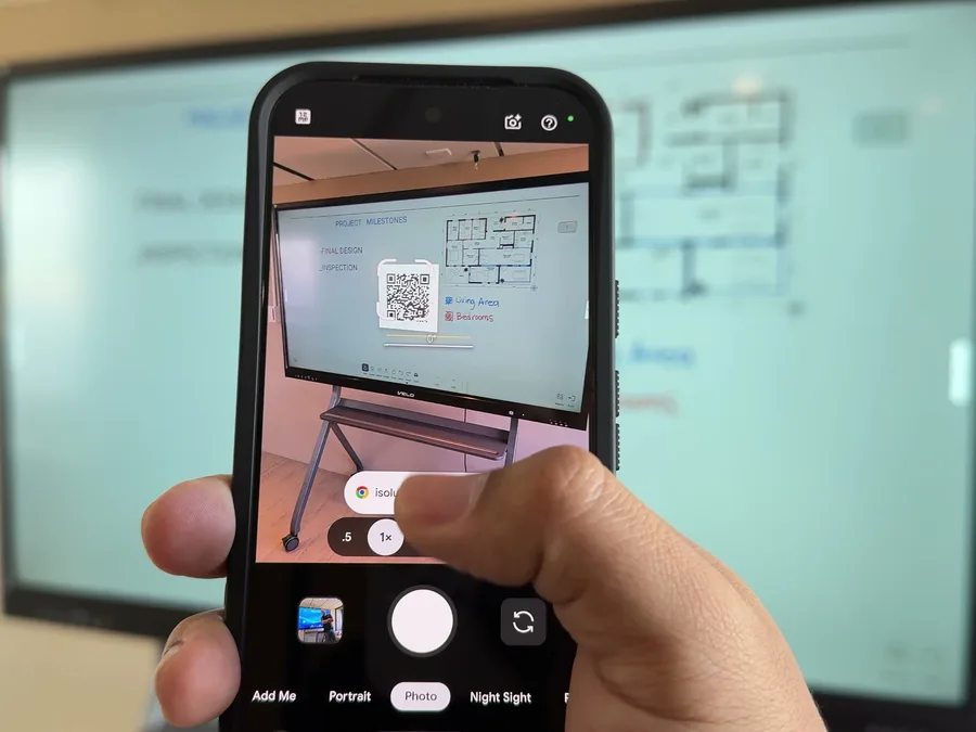 A phone scanning the Share by QR code on Veld Board